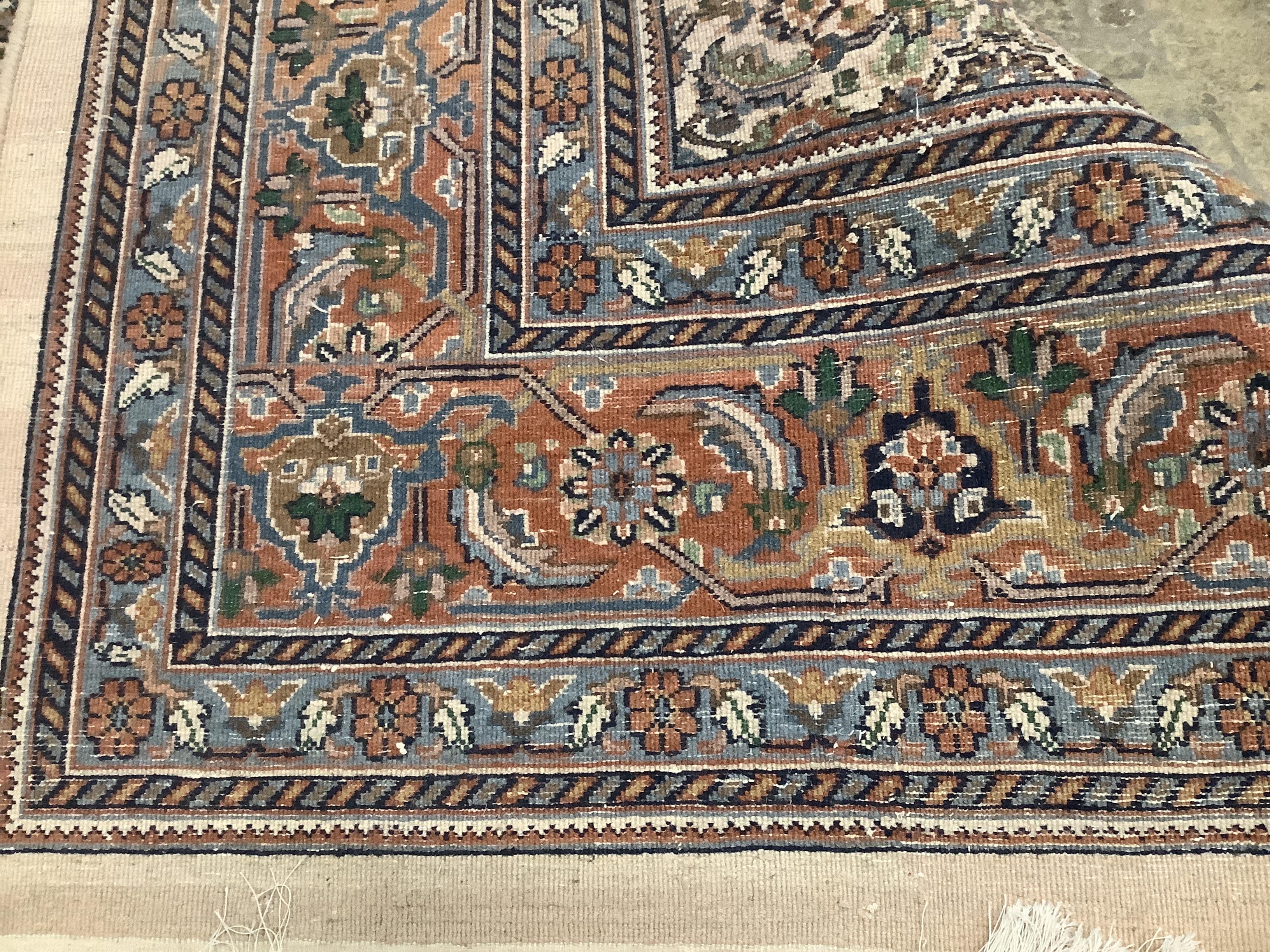 A North West Persian ivory ground carpet, 354 x 247cm